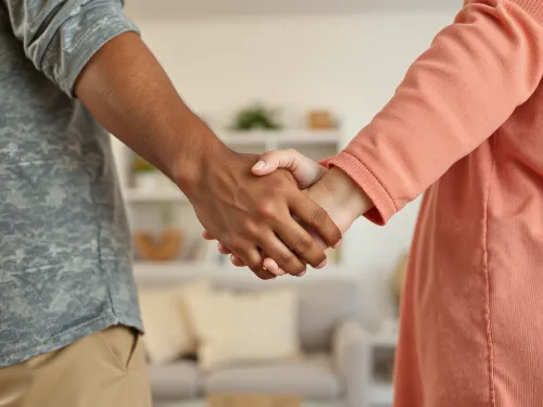 Couple holding hands, symbolizing emotional intimacy and connection